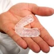 mouth guard for cutting teeth, which is a symptom of the presence of parasites